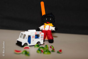 A visual representation of the song "N loves a watermelon". A gollywog, a good humor ice cream truck and some watermelon. singer: “hold up jackson! time to cut a watermelon. you n+ggers quit throwin’ them bones and come down and get your ice cream!” black men: “ice cream?” singer: “yes. ice cream! colored man’s ice cream. watermelon!”