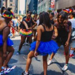 Young dancers rehearsing before their turn at the pride parade.