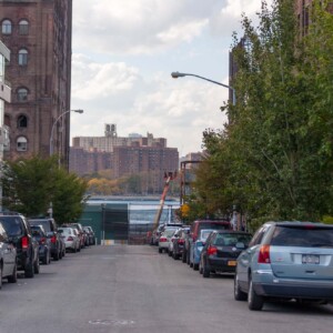 Williamsburg Car lined Williamsburg street with new construction facing the Domino sugar factory and the river