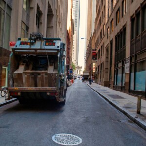 Garbage Truck a Garbage truck in a narrow street in downtown Manhattan