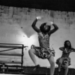 Two young girls dancing
