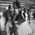 Queen Amor dances in a subway station